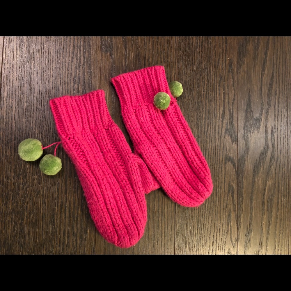 Fun hot pink mittens with green pom poms!
